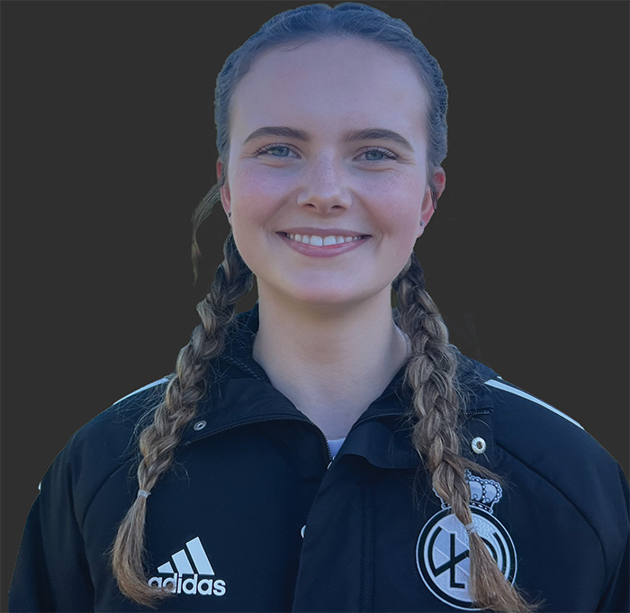 Thumbnail image of Alexandra Barling wearing a club Adidas jacket with club logo