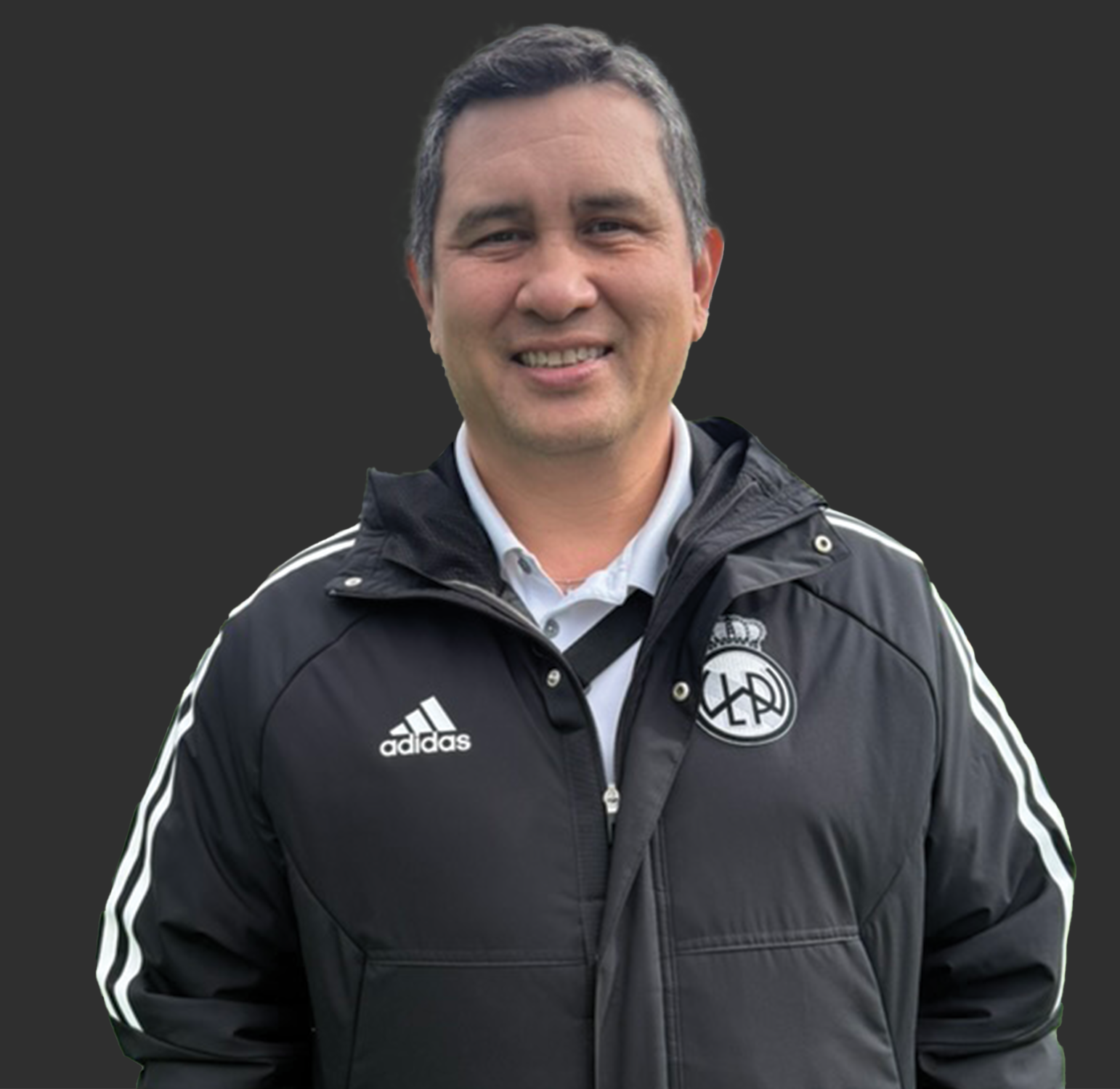 Thumbnail image of Chris Wolfe wearing a club Adidas jacket with club logo