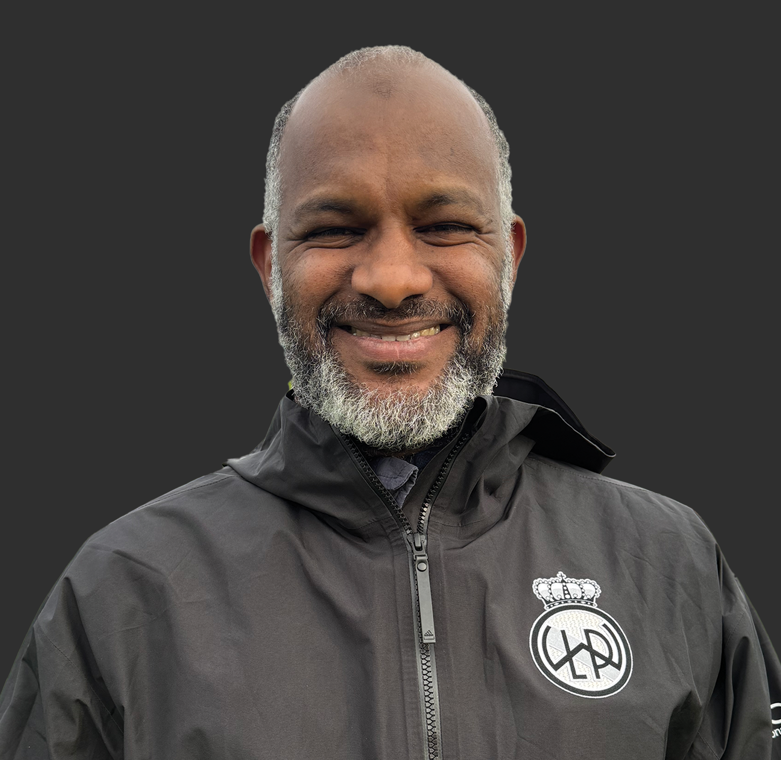 Thumbnail image of Elbagir Abdulmagid wearing a club Adidas jacket with club logo