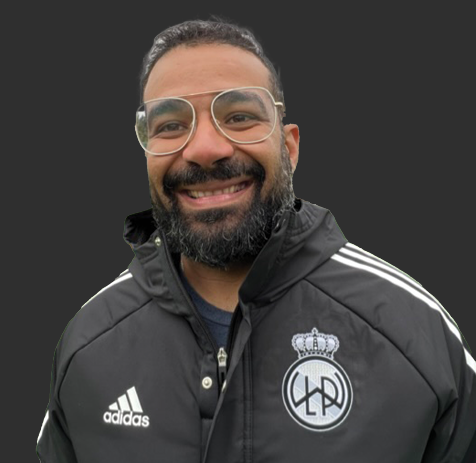 Thumbnail image of Segun Amusan wearing a club Adidas jacket with club logo